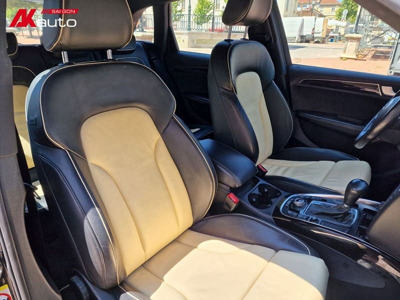 Ghế da phối màu đen và kem trong Audi Q5, tạo điểm nhấn tinh tế và hiện đại, mang lại cảm giác thoải mái và phong cách.